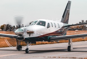 Small airplane on runway about to take off